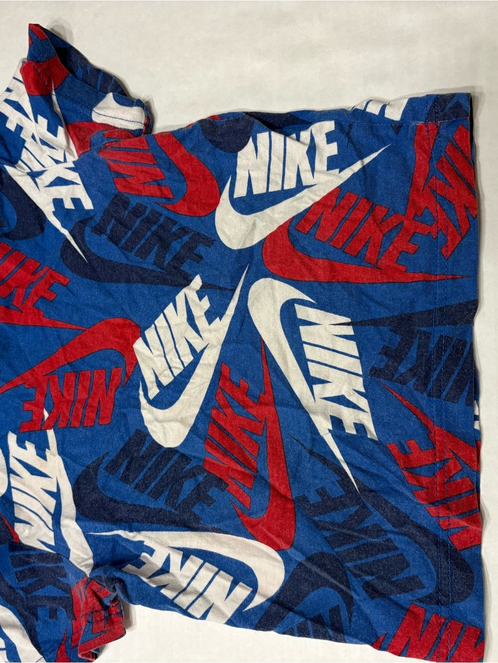 Nike Blue Tee with Red & White Swoosh Print